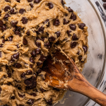 bowl of cookie dough with wooden spoon